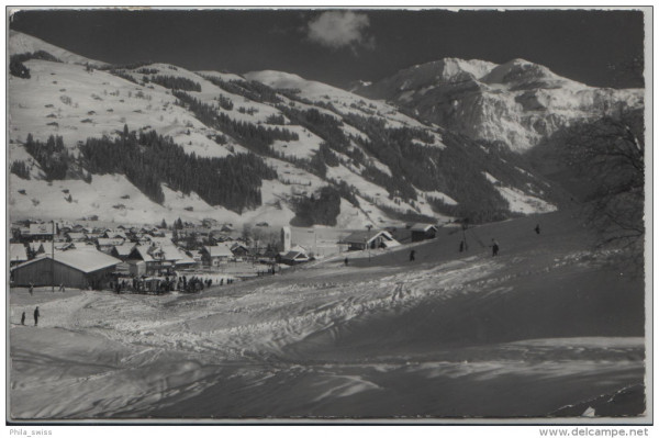 Lenk mit Wildstrubel im Winter d'hiver mit Skipiste, Skilift, Ski